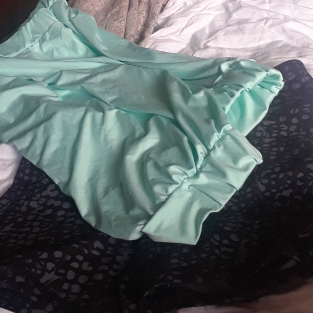 Brand new flowy tube top in mint.